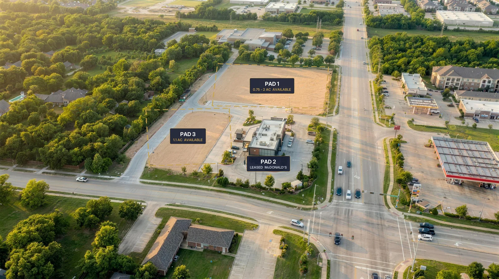 Conceptual aerial rendering of the S. Cooper Street pad sites delivered pad-ready: Pad 1 at 0.75 to 2 acres and Pad 3 at 1.1 acres outlined as graded land beside the leased McDonald's corner pad