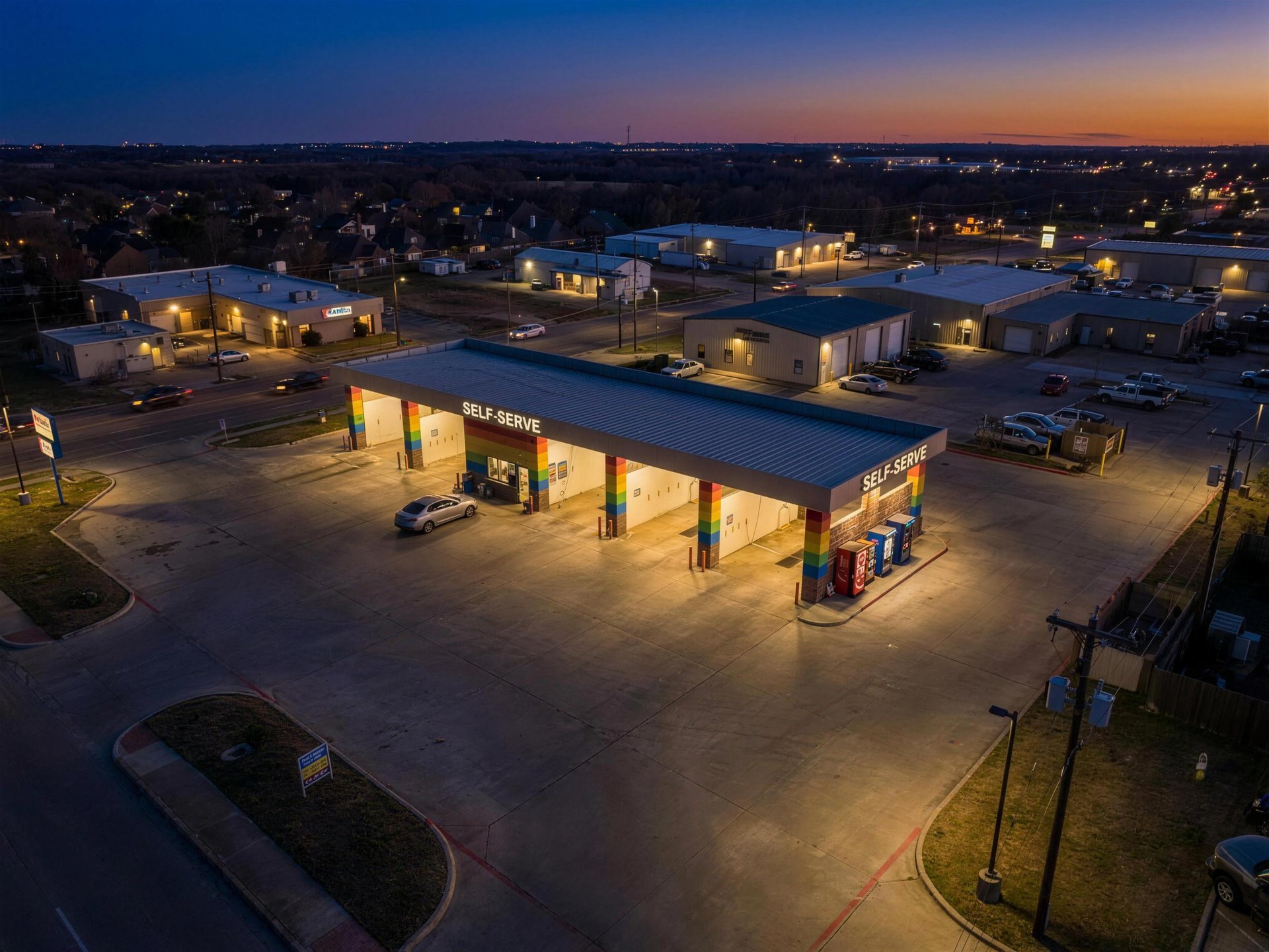 Aerial view of the property at twilight